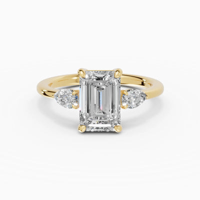 Anillo de compromiso ELARA esmeralda trilogía en oro amarillo 18k
