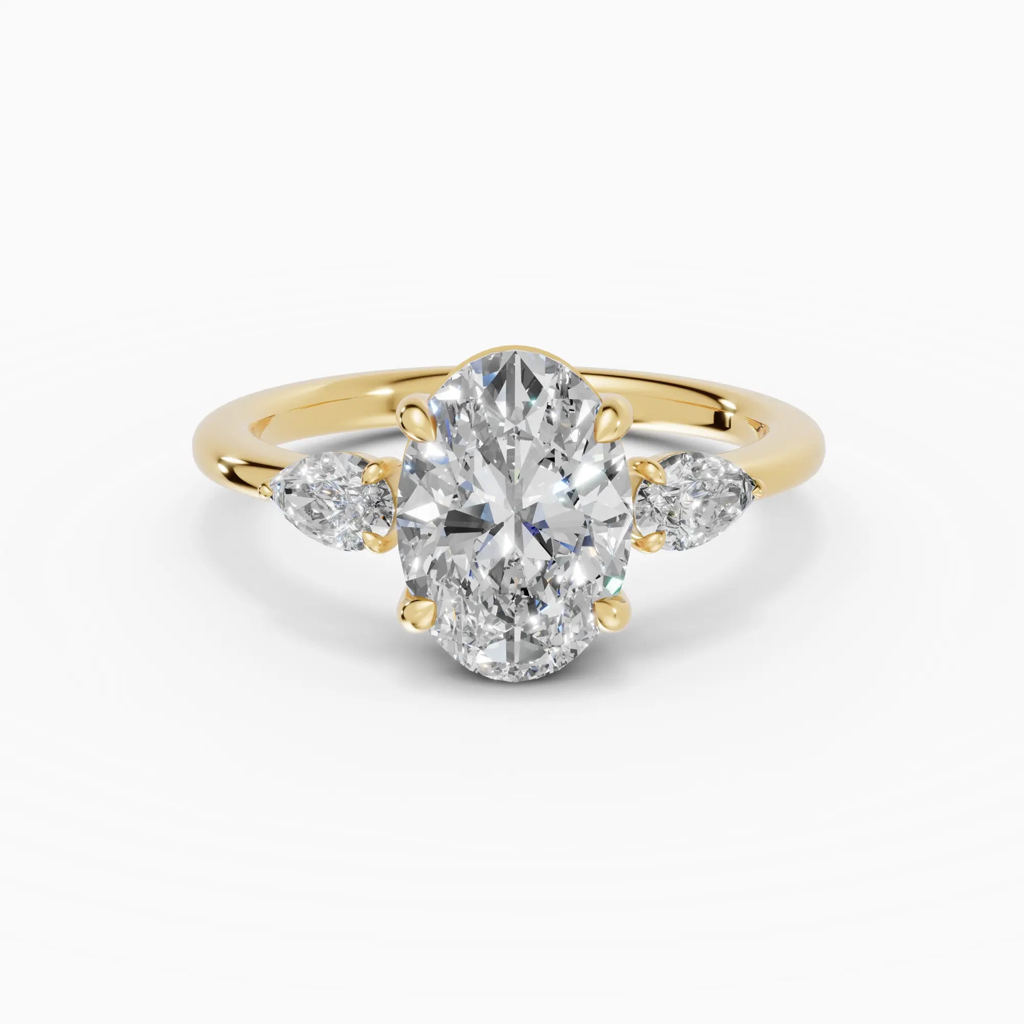 Anillo de compromiso ELARA oval trilogía en oro amarillo 18k