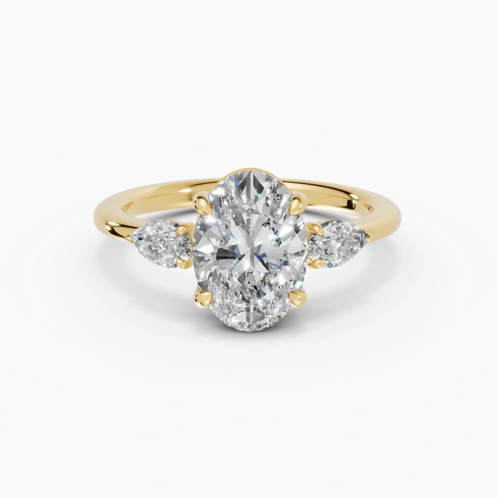 Anillo de compromiso ELARA oval trilogía en oro amarillo 18k