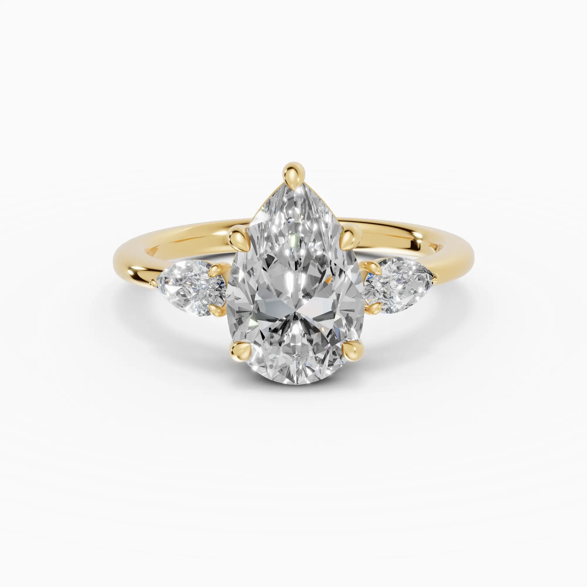 Anillo de compromiso ELARA pera trilogía en oro amarillo 18k