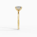 Flora engagement ring in yellow gold with 2-carat cushion cut diamond, profile view