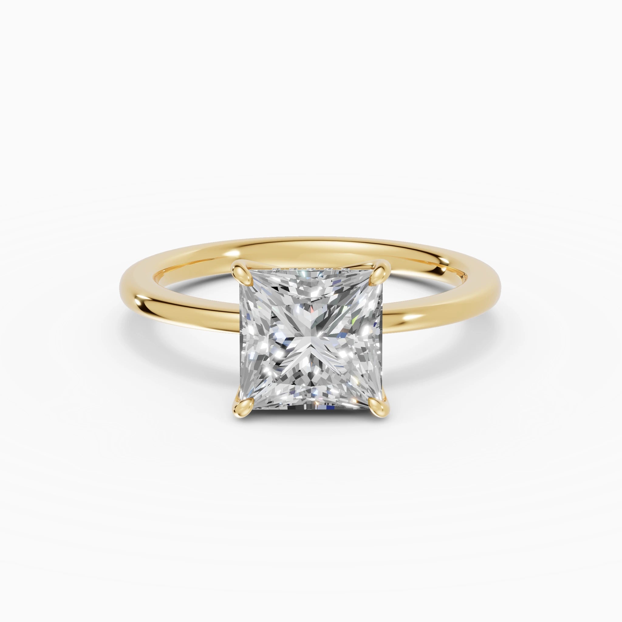 Anillo de compromiso Flora en oro amarillo con diamante corte princesa de 2 quilates detalle del aro