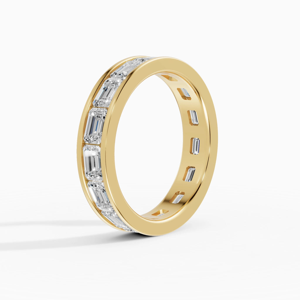 Anillo de compromiso Volta en oro amarillo de 4 mm con diamante corte esmeralda 4x2,8 mm vista lateral