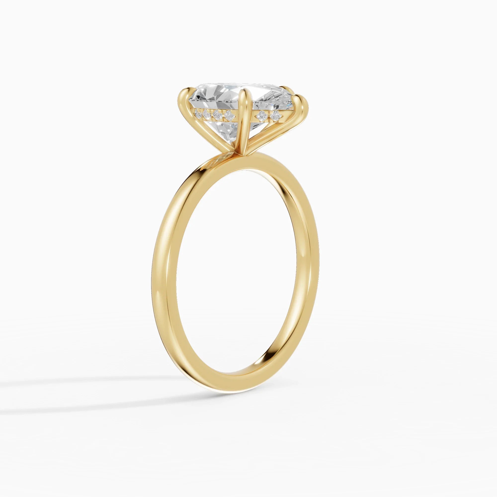 Anillo de compromiso THEIA pera solitario halo escondido en oro amarillo - vista lateral