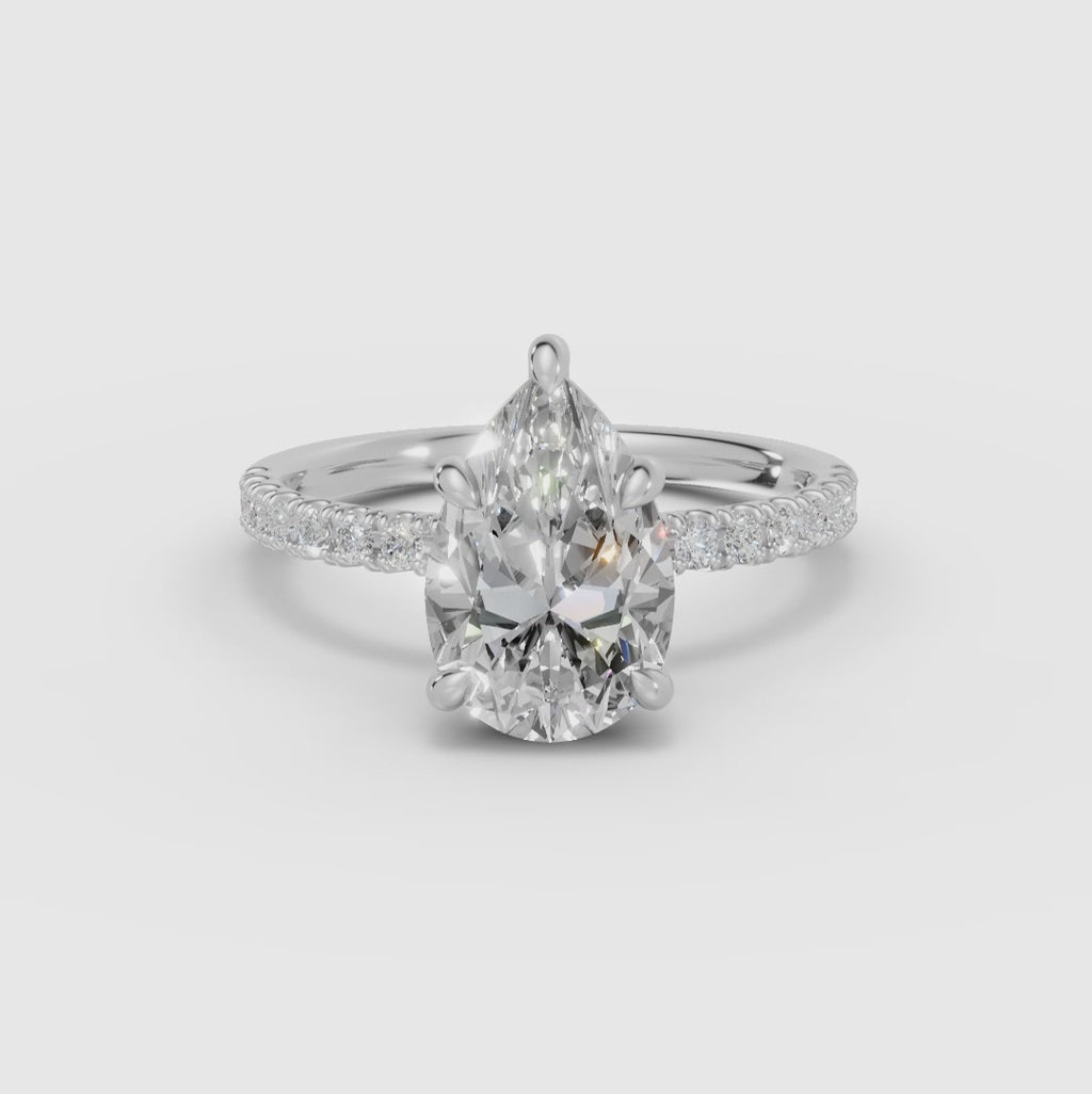 AURORA | Anillo solitario corte pera medio pavé