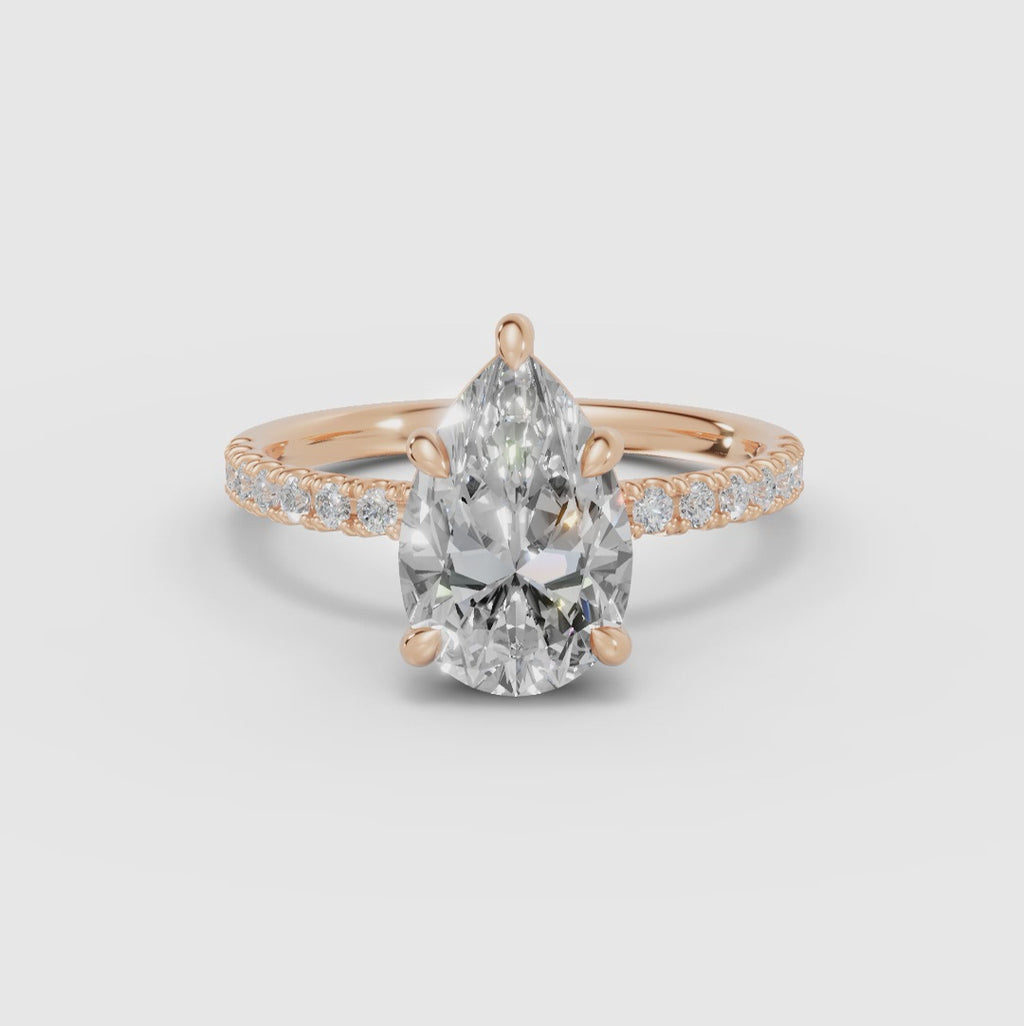 AURORA | Anillo solitario corte pera medio pavé