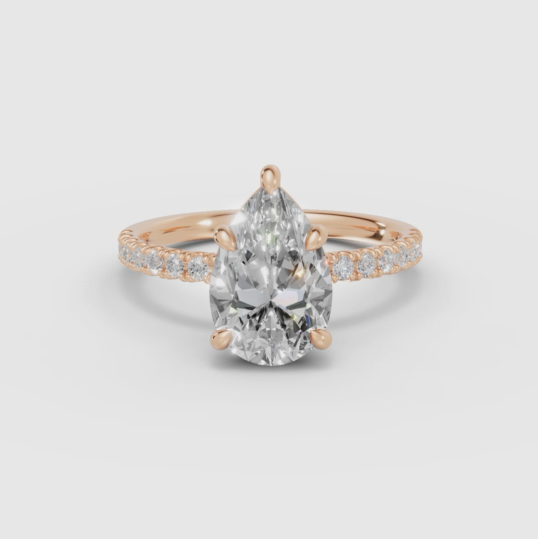 AURORA | Anillo solitario corte pera medio pavé