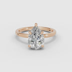 Vídeo 360° del anillo de compromiso THEIA solitario halo escondido pera en oro rosa
