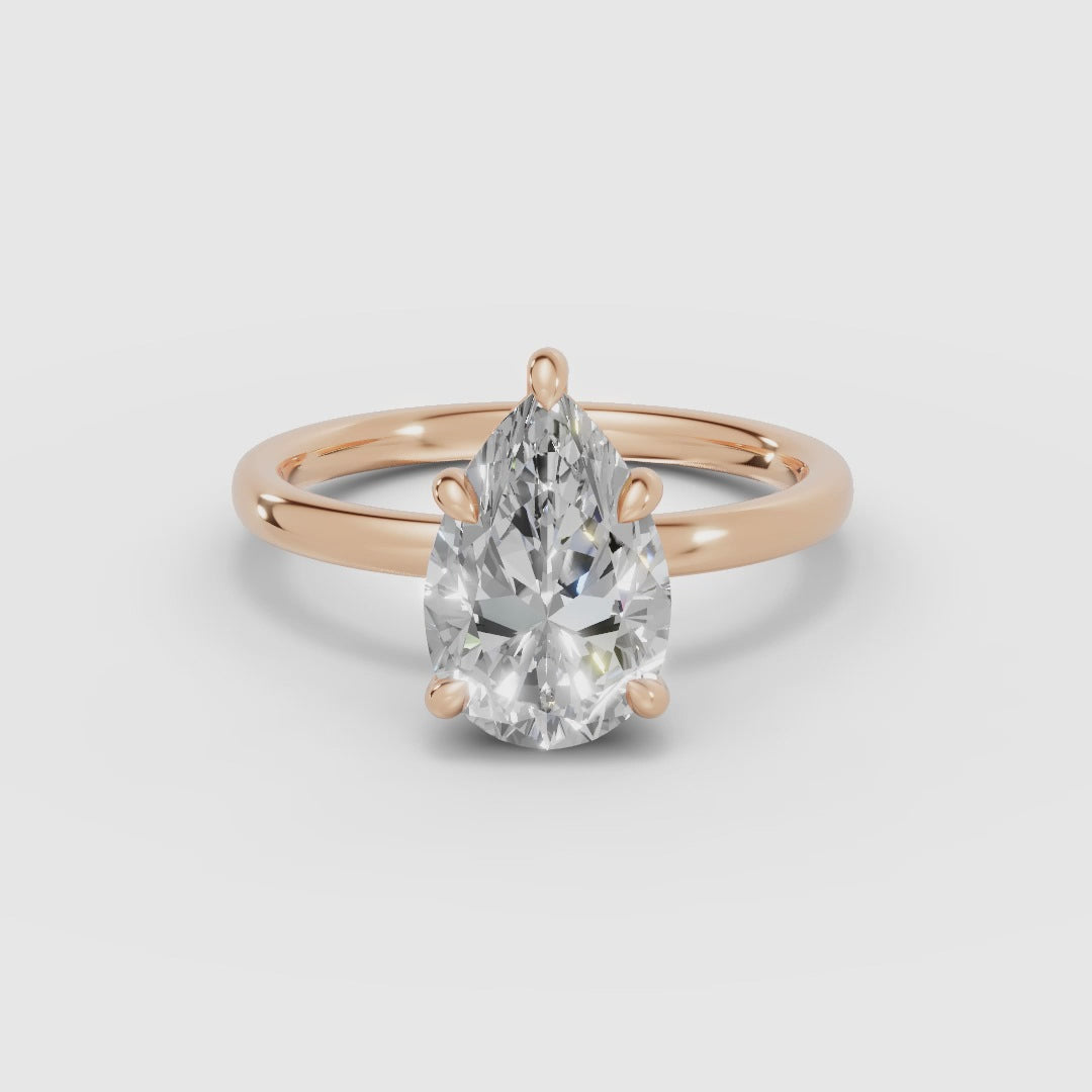 THEIA | Anillo solitario halo escondido pera