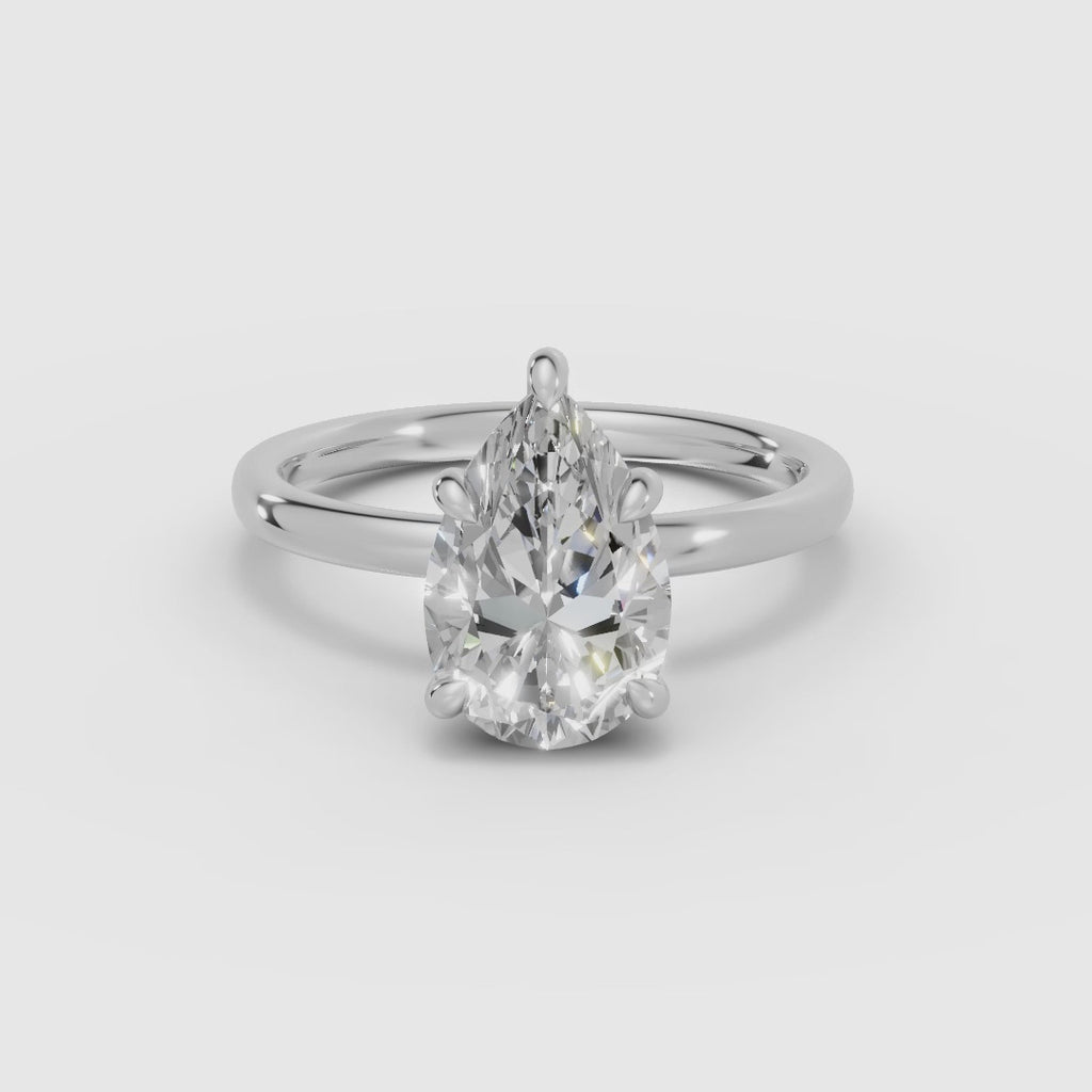 THEIA | Anillo solitario halo escondido pera