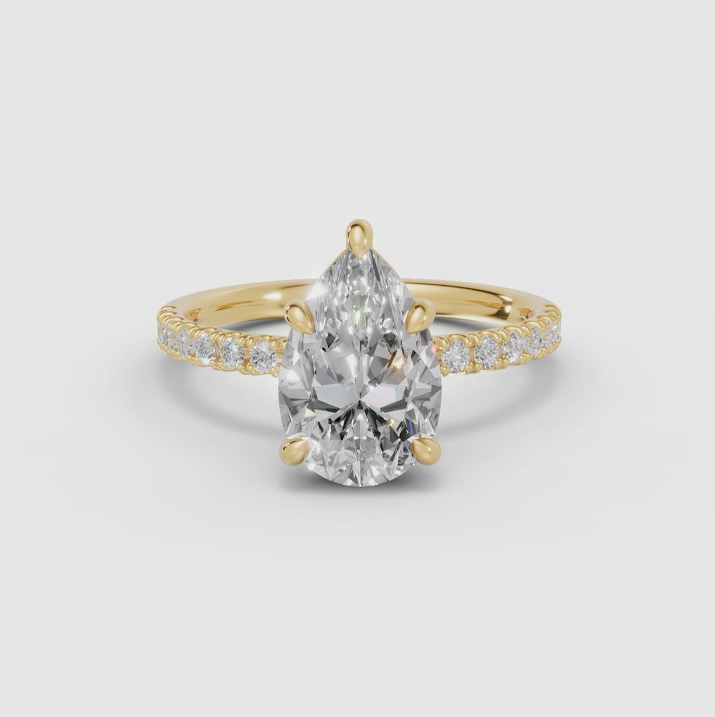 AURORA | Anillo solitario corte pera medio pavé