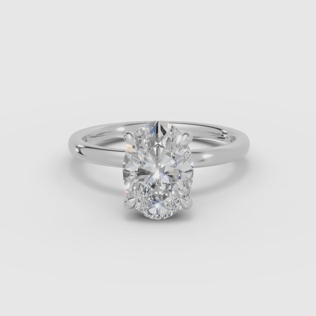 THEIA | Anillo solitario halo escondido oval
