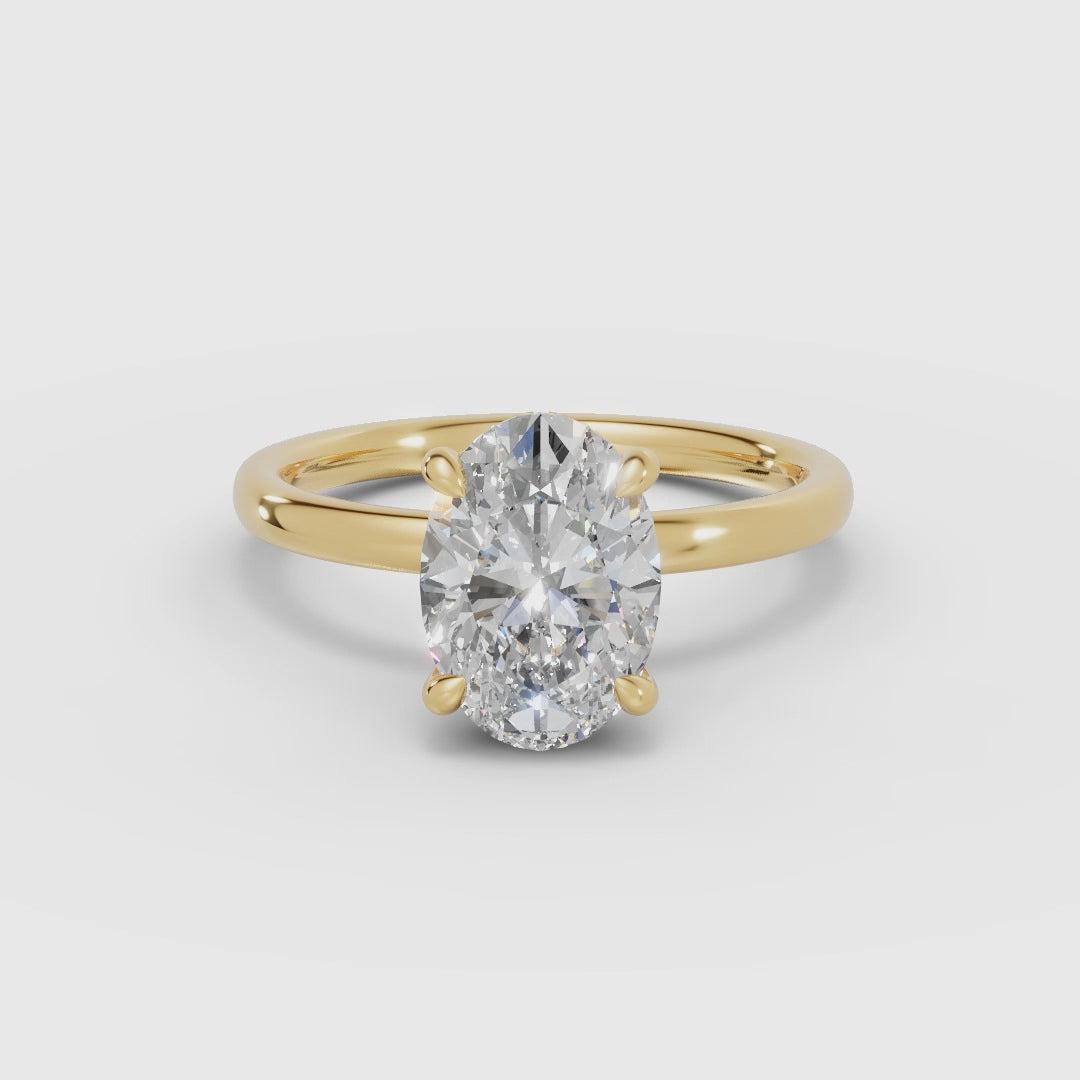 THEIA | Anillo solitario halo escondido oval